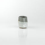 Hand-thrown ceramic sake cup with contrasting matte and glossy grey glazes, by The Lazy Potters.