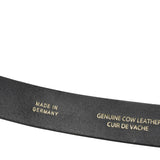 Black leather belt with 'Made in Germany' and 'Genuine Cow Leather' text on a white background