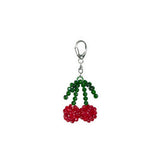Beaded keychain with red and green beads on a white background