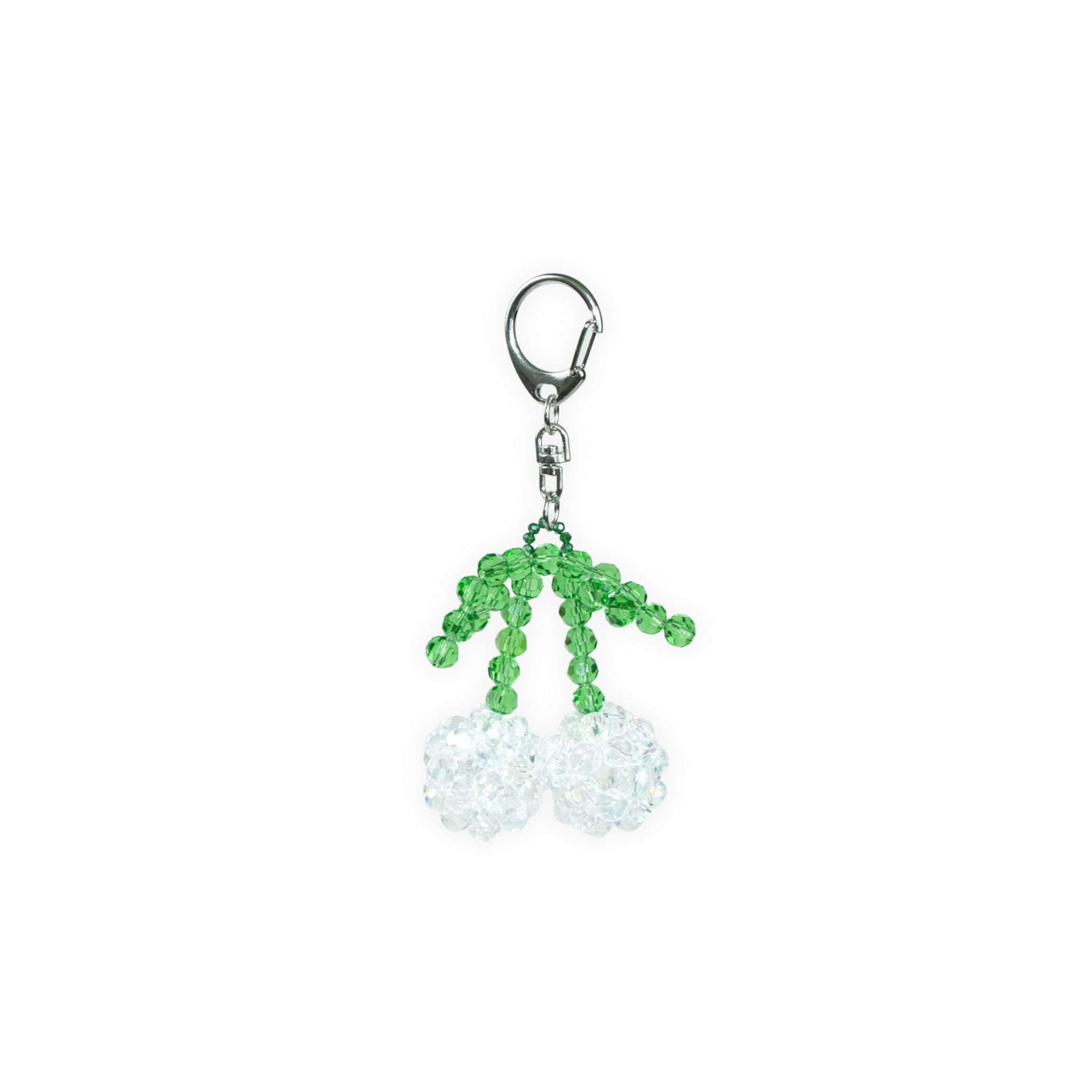 Green and white clear beaded keychain with a silver clasp on a white background