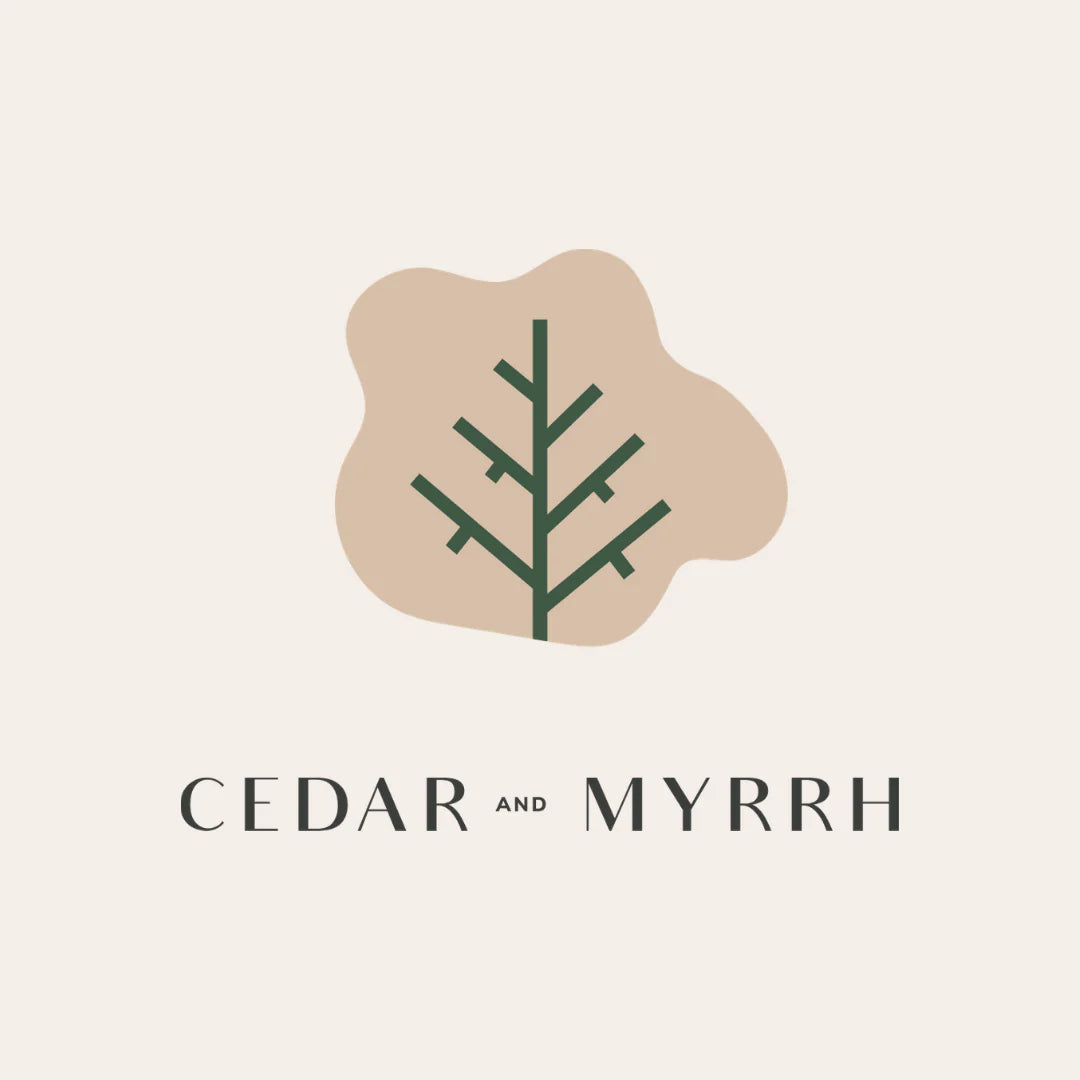 Logo for 'Cedar and Myrrh' with a stylized tree branch on a beige background.