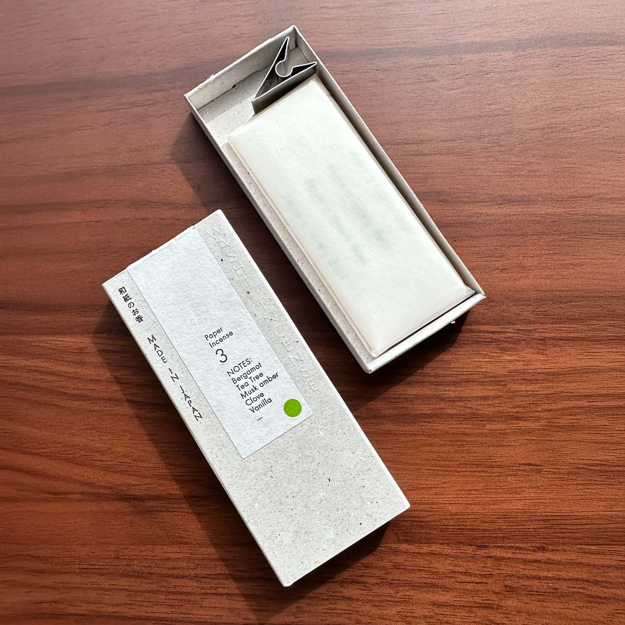 Opened box of Morihata's washi paper incense strips Deep Citrus displaying the contents