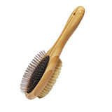 Wooden dog brush with bristle head on a white background