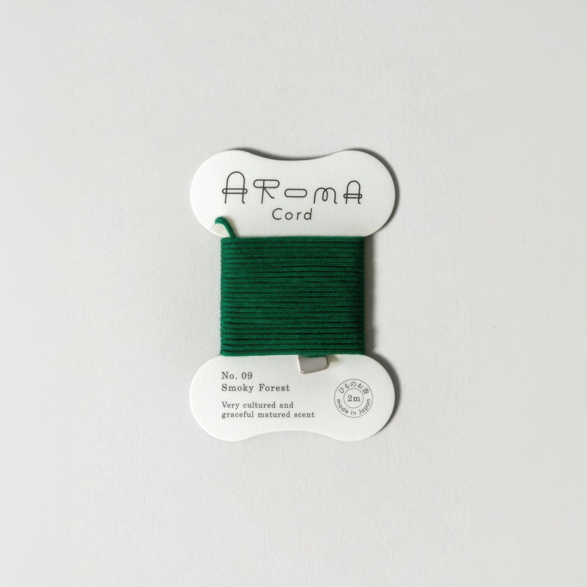 'Aroma Cord' No. 09 Smoky Forest on a light gray background