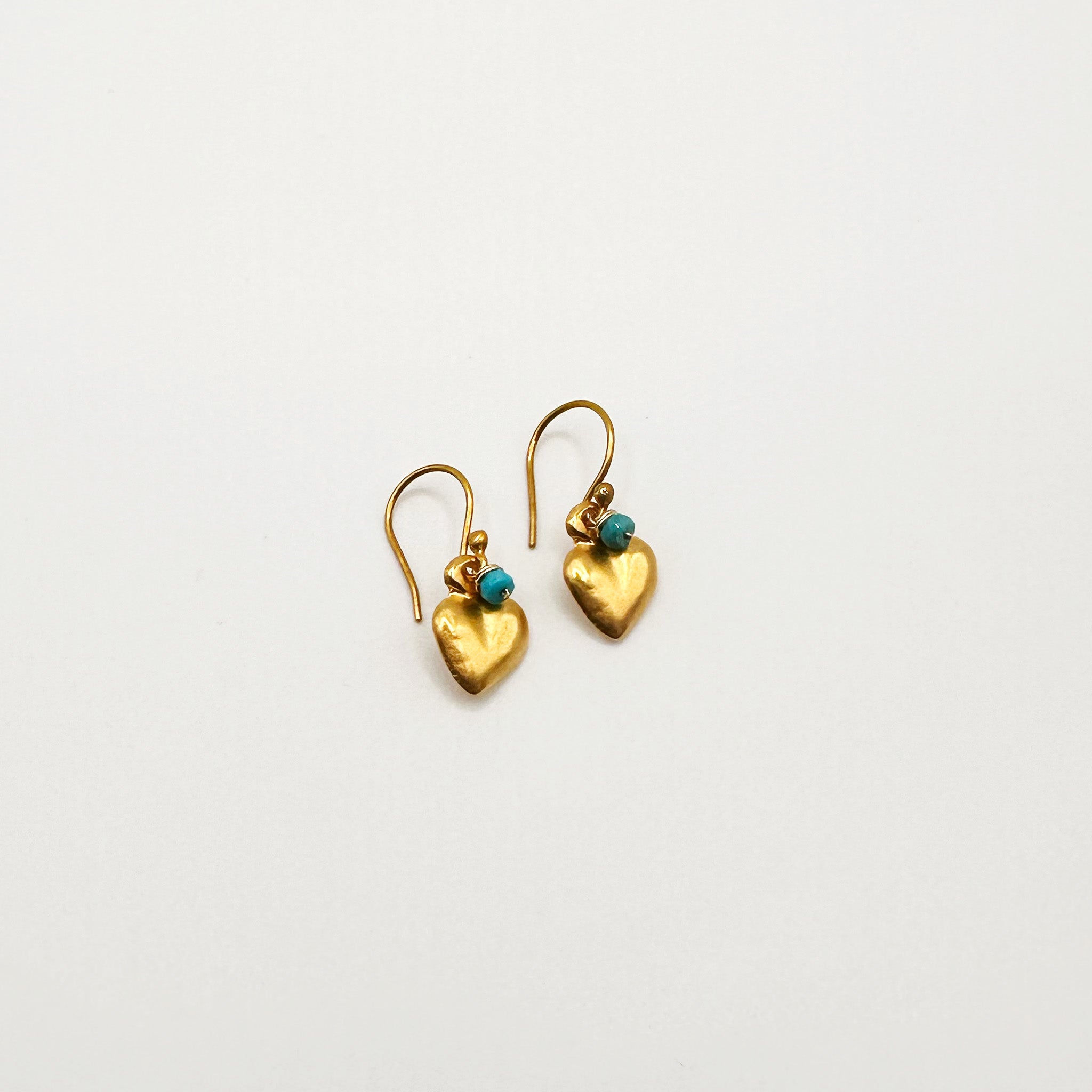 image of two river song earrings golden sweetheart milagros turquoise design