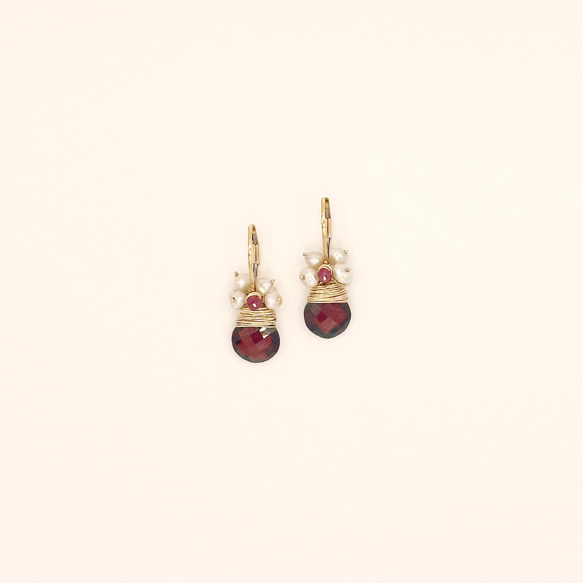 image of two river song earrings regal garnet fringe design