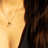 image of model wearing see real flowers necklace charm design