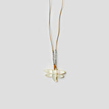 close up image of  see real flower necklace with dragonfly design