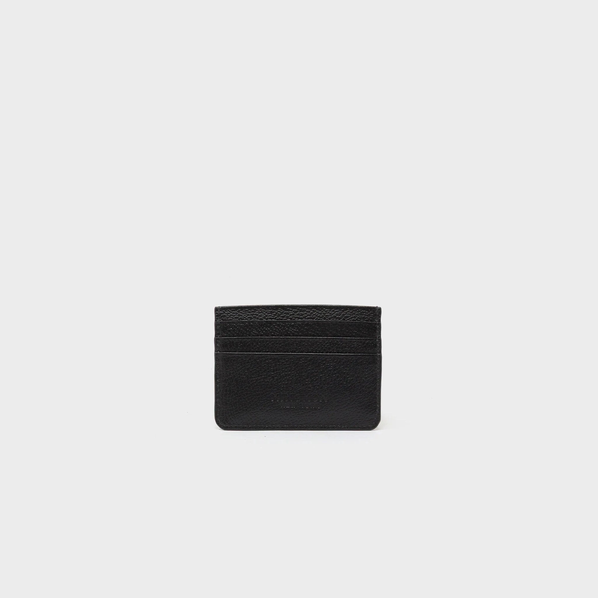 Back view of black cardholder with colorful embroidered designs on a white background