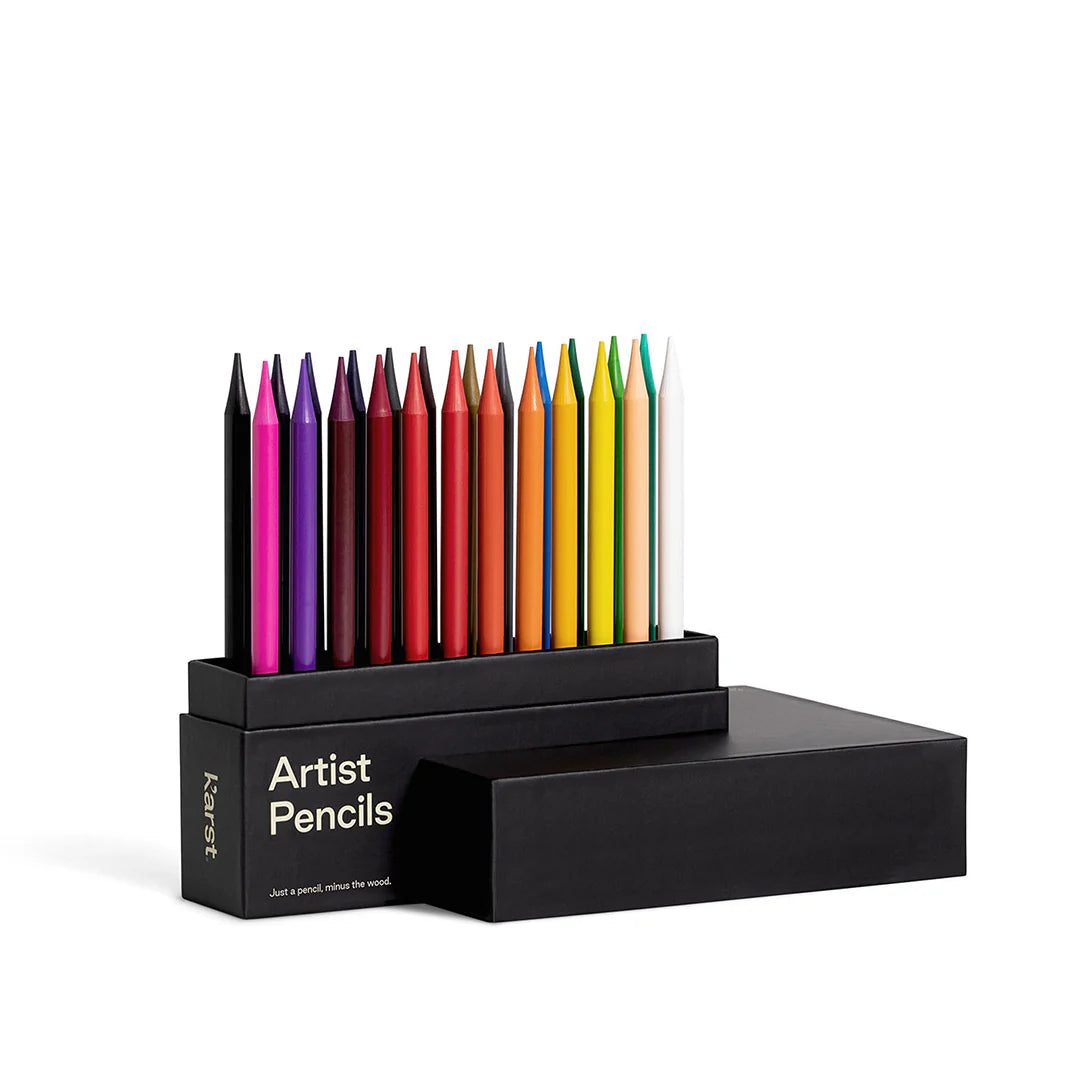 Angled view of set of Karst's colorful artist pencils in its packaging with just the lid off on a white background