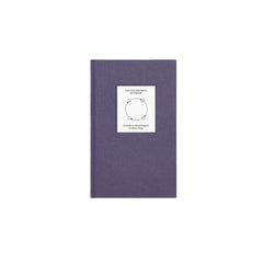 Top view of The Anti-Insomnia Notebook by Therapy Notebooks, featuring a linen hardcover with a minimalist stitched patch.