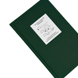 Top view of The Field Guide for Depression by Therapy Notebooks, featuring a linen hardcover with a minimalist stitched patch and embossed spine text.