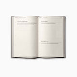 Open spread of The Therapy Journal by Therapy Notebooks, showing structured pages for writing session topics, notes, and key takeaways.