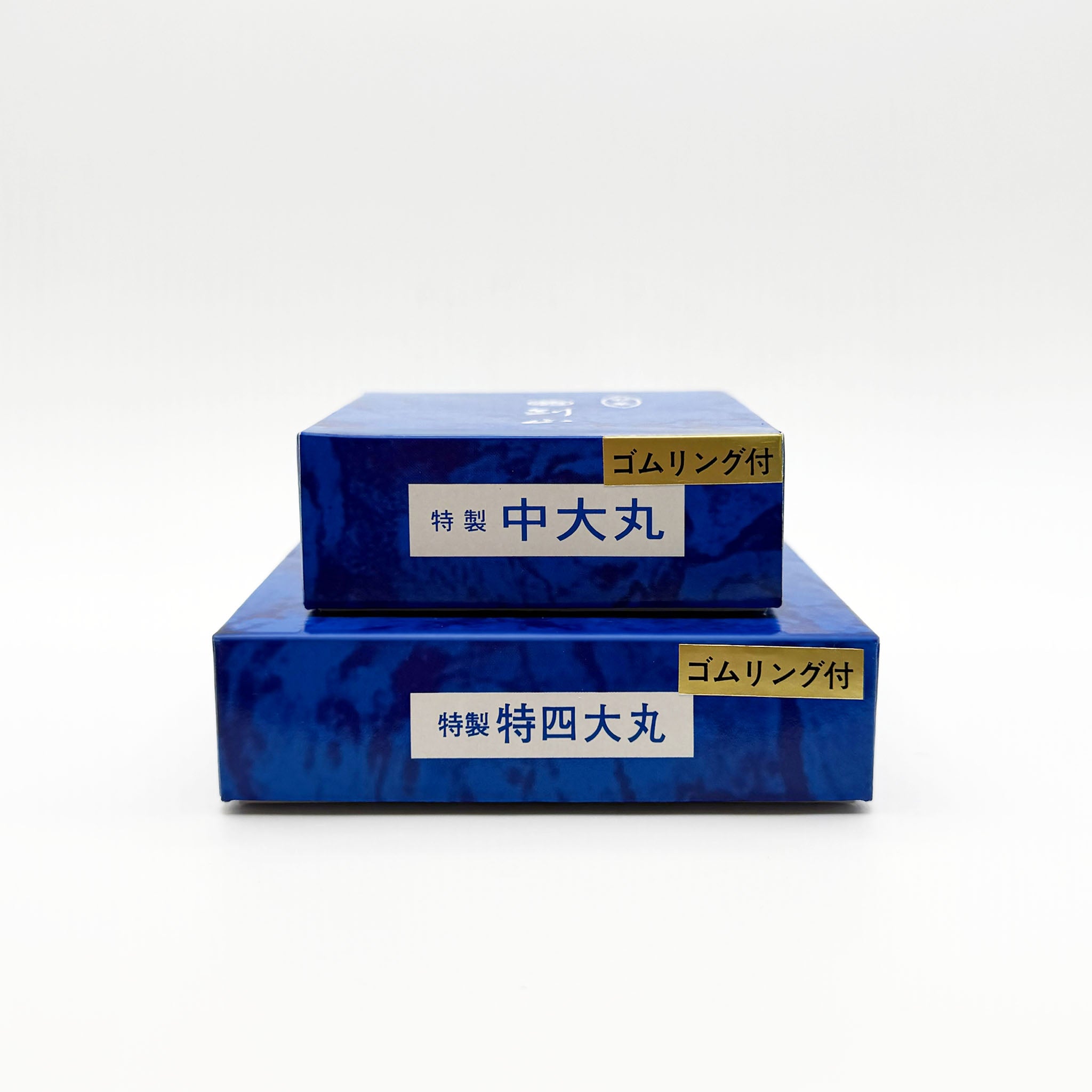 Two various sized blue boxes stacked for the Marufuji flower frogs on a white background