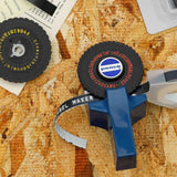 Penco label maker on a wooden surface