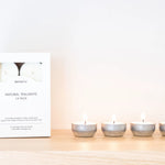 image of terralite tealights burning next to box