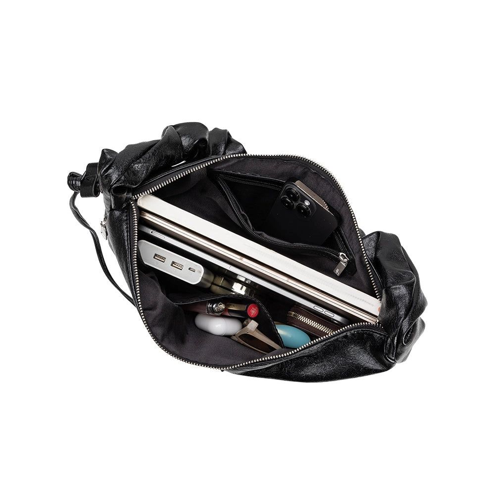 Top view of how much the Reign shoulder bag can hold