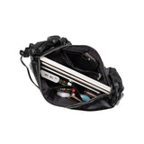 Top view of how much the Reign shoulder bag can hold