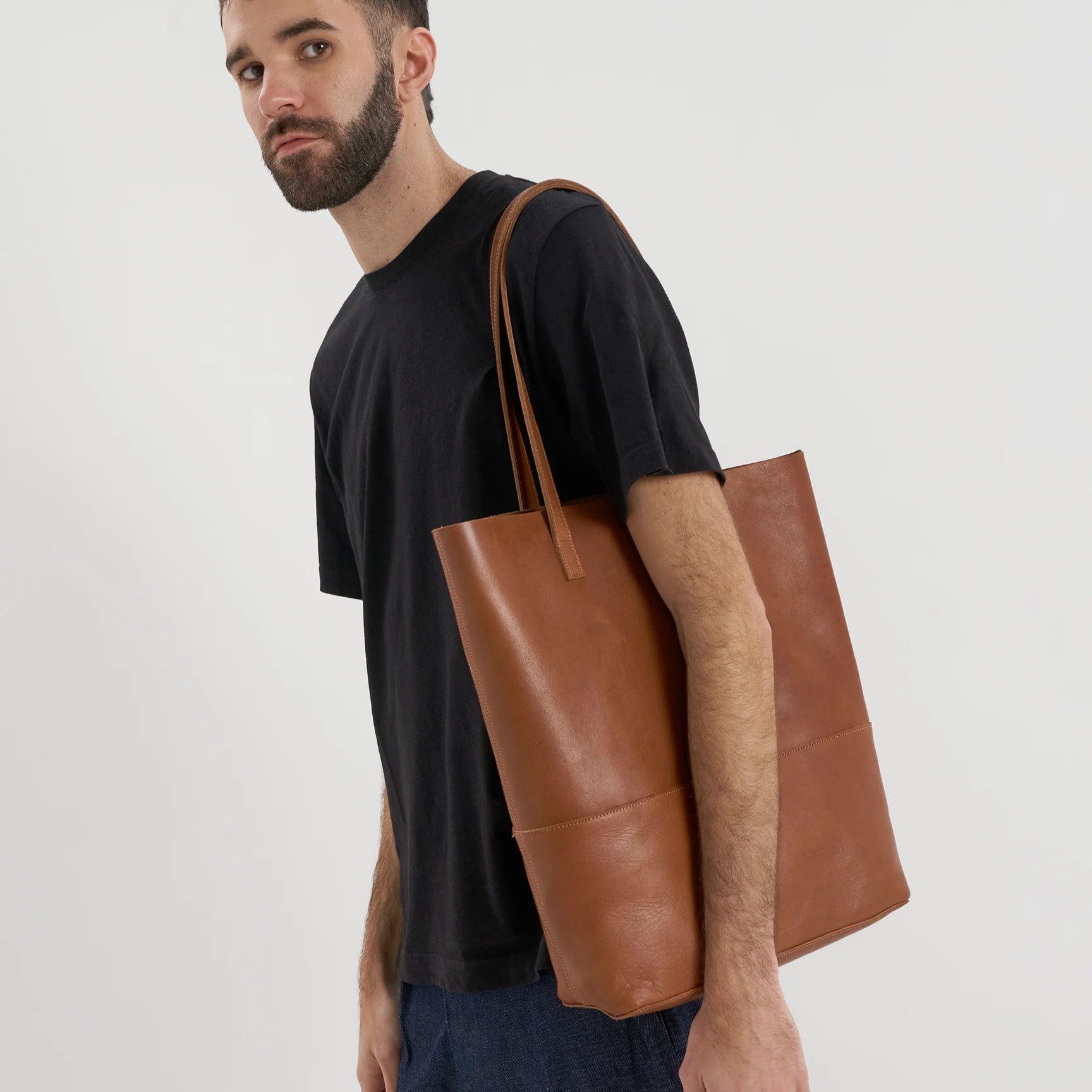 A model wears the Cabildo Tote by Nimes in tobacco