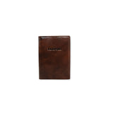 Brown leather passport holder on a white background