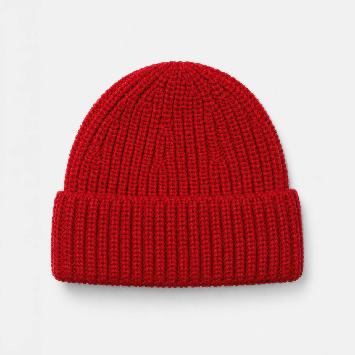 A bright red ribbed knit beanie hat, shown from the front on a clean white background.