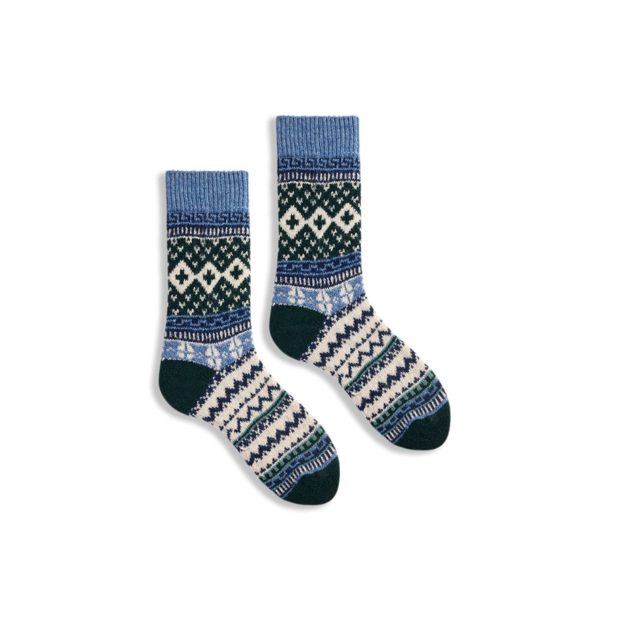 A pair of lisa b crew socks with a traditional Fair Isle pattern in blue, cream, and dark green, displayed against a solid white background.